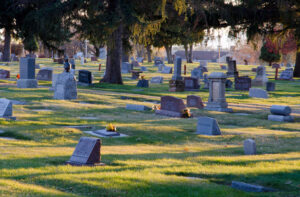 Burial vault being lowered into a cemetery grave.